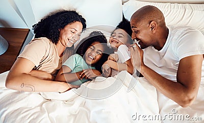Top view, bed and family with love, relax and quality time with happiness, wellness and bonding. Parents, mother and Stock Photo
