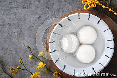 Top view of big tangyuan yuanxiao in a bowl on gray background for lunar new year food Stock Photo