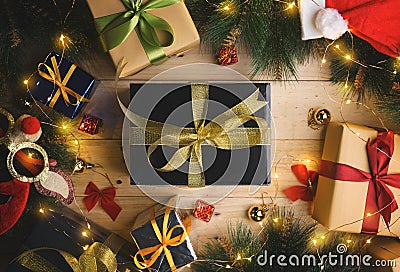 Top View of Black Gold Present Between Christmas Ornament on Woo Stock Photo