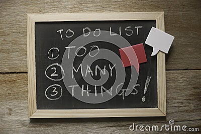 Top view of a blackboard with a chalk written with To do list : too many things! in numbers Stock Photo