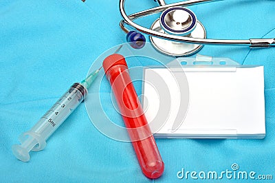 Blank security identity name card with a stethoscope on blue scrubs Stock Photo