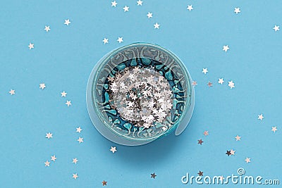 Top view of blue bowl with star glitter. Magic concept. Top view Stock Photo