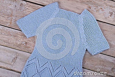 Blue crochet dress on table Stock Photo