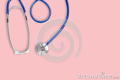 Top view of blue stethoscope medical on pink background Stock Photo