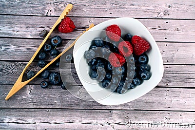 Top view of a bowl of blueberries on the table with a kitchen tool Stock Photo