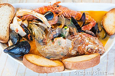 Top view of bowl with fish soup with seafood Stock Photo