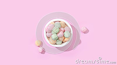 Top view of a bowl of jelly candies with different flavours isolated on a pastel pink background Stock Photo