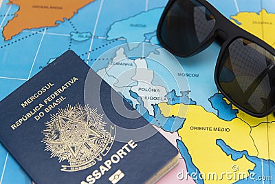 Top view of Brazilian passport over map. Focus on the European continent and the Middle East. Emigration, travel, destination Stock Photo