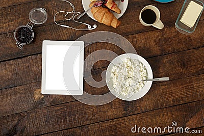 Top view breakfast table. Wablet in home kitchen with breakfast Stock Photo