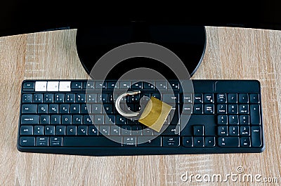 Top view of broken padlock on computer keyboard Stock Photo
