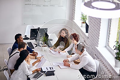 Top view on busy group of business people working in office Stock Photo