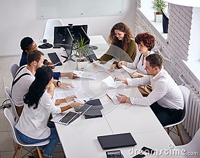 Top view on busy group of business people working in office Stock Photo