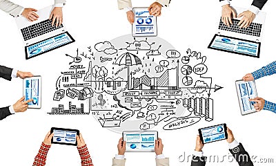 Top view of businesspeople sitting at table and using gadgets Stock Photo