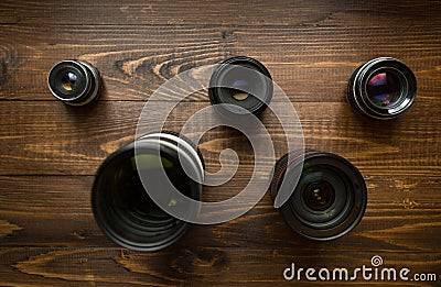 Top view of camera lenses organized in shape of Olympic emblem Stock Photo