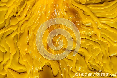 Top view of the candle melts droplets dissolve in yellow from lighted candlestick Stock Photo