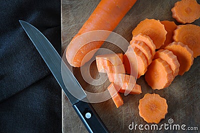 Top view of Carrot Cutting on Wooden Board Stock Photo