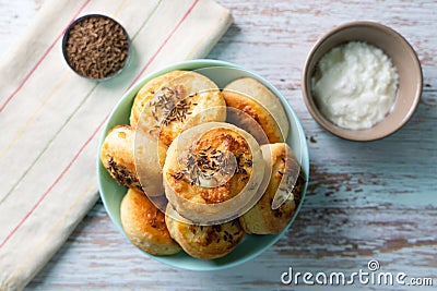 Top view on Cheese Bannock in plate on rustic wood table copy space Stock Photo