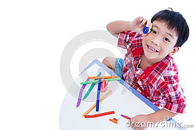 Top view. Child show his works from clay, isolated on white. Str Stock Photo