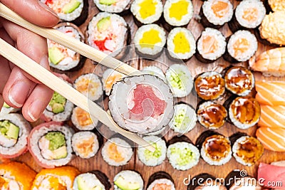 Top view of chopsticks with roll over many sushi Stock Photo