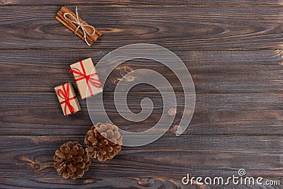 top view of christams gift with pine cones and cinnamon sticks Stock Photo