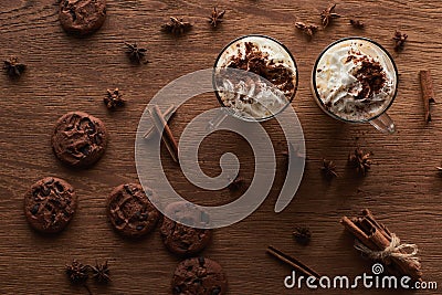 Top view of Christmas cacao near cookies, anise, cinnamon on wooden table. Stock Photo