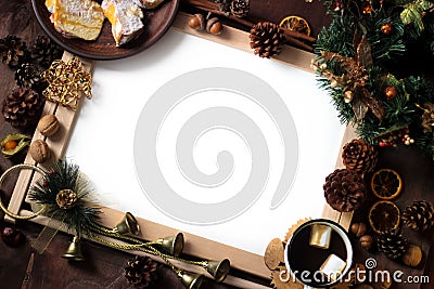 Top view of Christmas decor with copy space area. Christmas objects: dried sliced orange, cinnamon, pine cone, fir branch, cup Stock Photo