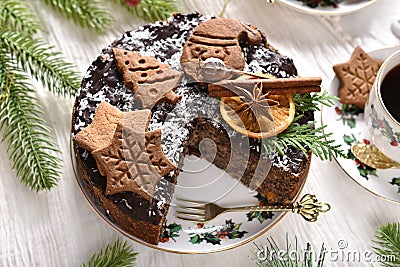 Top view of Christmas pastry called Japanese poppy seed cake decorated with gingerbread cookies Stock Photo