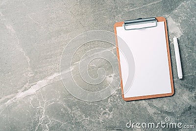 Top view of clipboard, paper, pen on marble background with copy space. Top view, copy space. Blogger, feminine business concept. Stock Photo