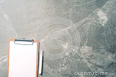 Top view of clipboard, paper, pen on marble background with copy space. Top view, copy space. Blogger, feminine business concept. Stock Photo