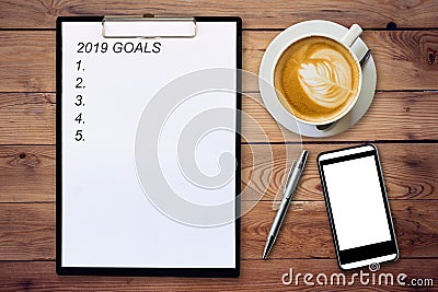 Top view of clipboard written Goals 2019 on wooden background wi Stock Photo