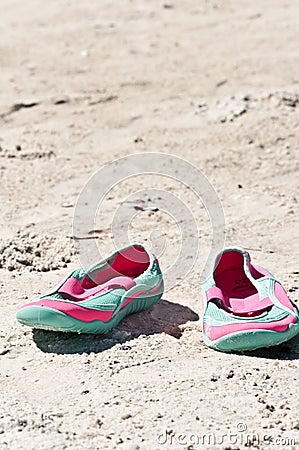 Female, sandles in the sand of a tropical beach Stock Photo