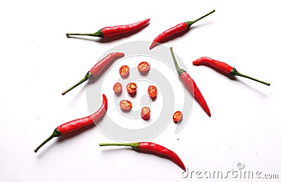 Top view and close up Group of red chili peppers and sliced red chili isolated on white background. Stock Photo