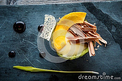 top view closeup exquisite dessert of baked avocado with chocolate Stock Photo