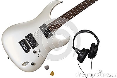 Top view of closeup of white electric guitar, two mediators and headphones. Workspace of musician. Isolated on white background Stock Photo