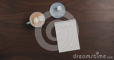 Top view cocoa and notepad with new year goals on walnut table Stock Photo