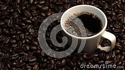 Top view of coffee or espresso with piles of coffee beans. Close up. Comestible. Stock Photo