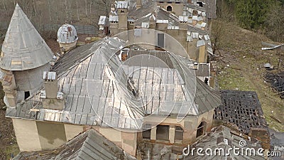 View on dilapidated roof of old building in forest. Top view of a collapsing building that does not have glass and the roof collapses, the building is located in View on dilapidated roof of old building in forest. Top view of a collapsing building that does not have glass and the roof collapses, the building is located in