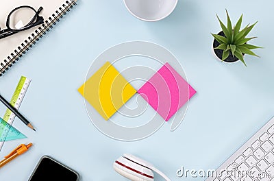 Top View 2 Color Stick Note or Note Pad on Blue Pastel Minimalist Background Stock Photo