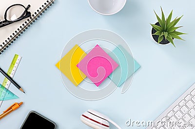 Top View 3 Color Stick Note or Note Pad on Blue Pastel Minimalist Background Stock Photo