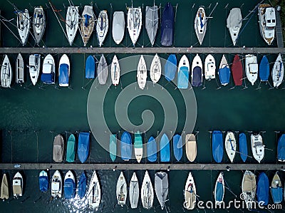 Top view of colorful boats and yachts parking by the docks of a marina on Lake Lucerne, in Fluelen Stock Photo