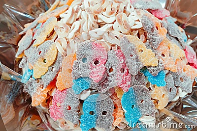 colorful sugar marmalade in the form of a skull and crossbones in the window of a candy store Stock Photo