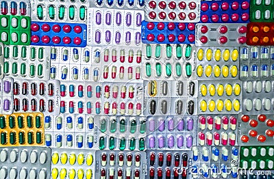 Top view of colorful tablets and capsule pills in blister packaging arrange with beautiful pattern. Pharmaceutical industry Stock Photo