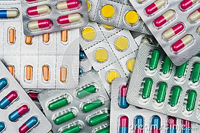 Top view of colorful tablets and capsules pills in blister packs. Global health care and drug use with reasonable concept. Stock Photo