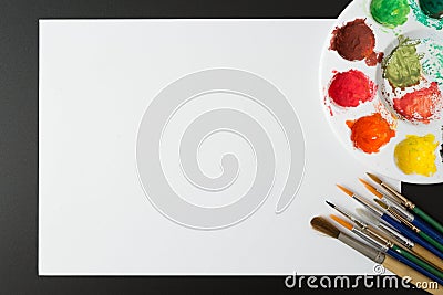 Top view of Colorful Watercolor palette, paper on a black backgroundand copy space Stock Photo