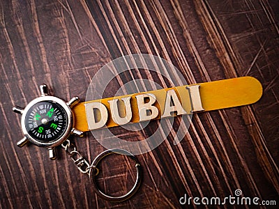 Top view compass and wooden word with text DUBAI Stock Photo