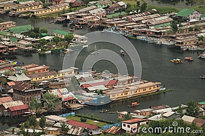 Top view of congested houseboats, shikara, boats, and houses in blue waters of Dal Lake. Jammu and Kashmir, India Editorial Stock Photo