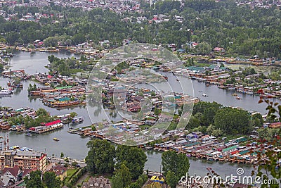 Top view of congested houseboats, shikara, boats, and houses in blue waters of Dal Lake. Jammu and Kashmir, India , Asia Editorial Stock Photo