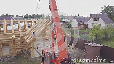Top view of construction of wooden houses. Clip. Process of construction of country wooden house on background of Editorial Stock Photo