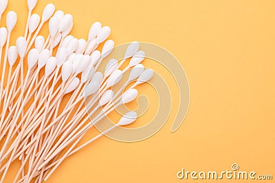 Top view cotton bud for cleaning the ears on yellow Stock Photo