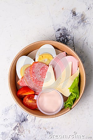 top view of a craft breakfast plate, sausage, tomato, egg and cheese. Stock Photo